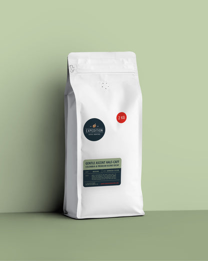 Half-caff coffee beans in a white coffee bag from expedition coffee roasters with a label on a green background, 2.1kg of beans