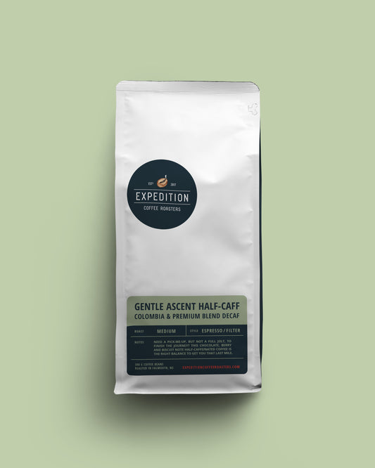 Coffee package labeled 'Expedition Coffee Roasters' on a light green background, for the Gentle Ascent half-caffeinated roast.